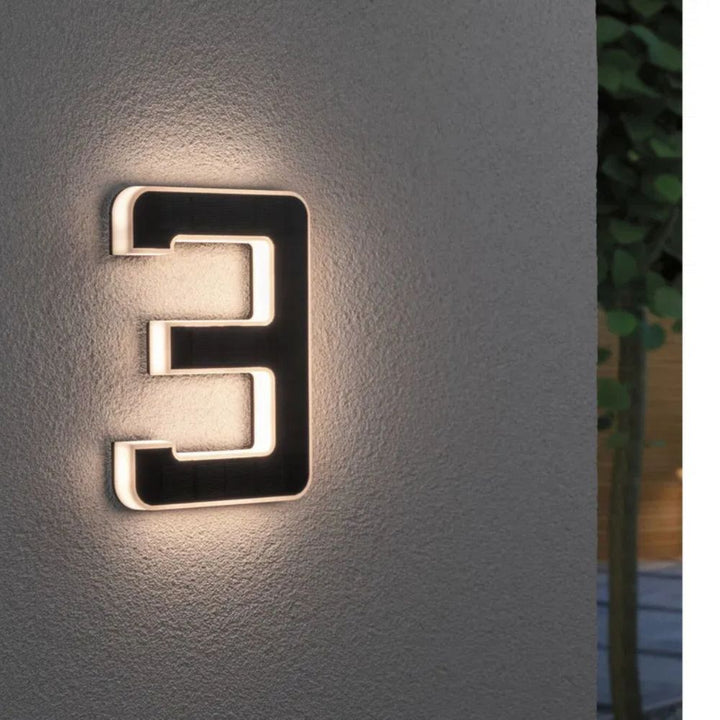 Solar-lit house number with LED and dusk sensor