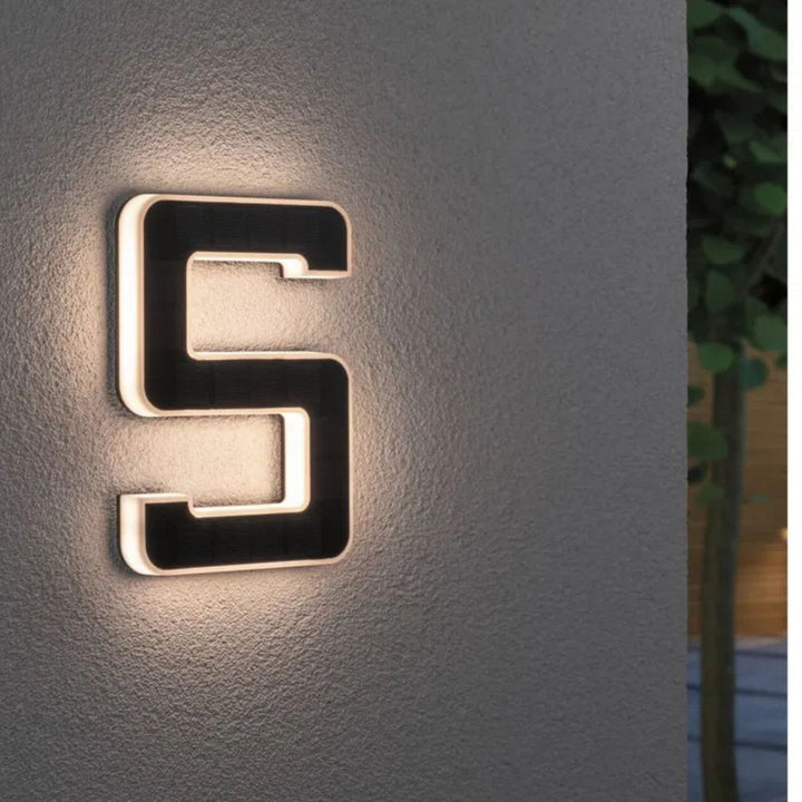 Solar-lit house number with LED and dusk sensor