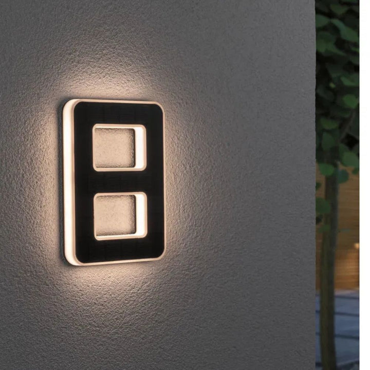 Solar-lit house number with LED and dusk sensor