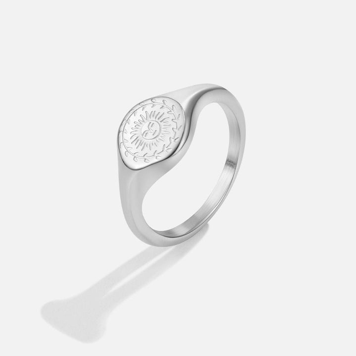 Silver ring with sunburst motif