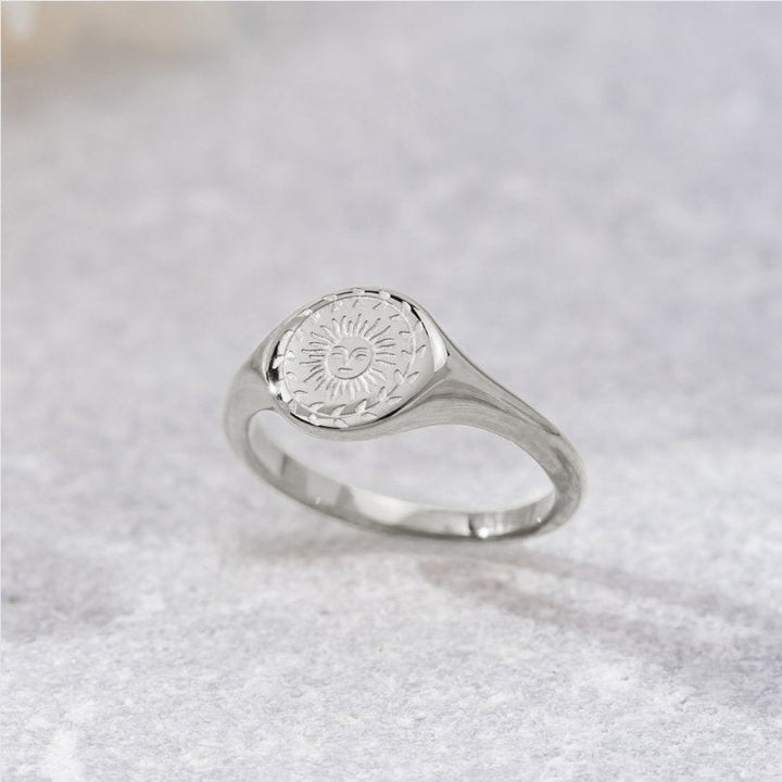 Silver ring with sunburst motif